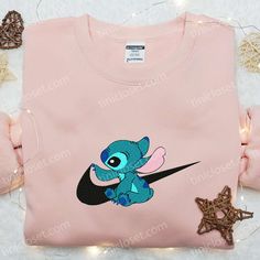 Stitch x Swoosh Embroidered Sweatshirt, Disney Characters Embroidered Hoodie, Best Gift Ideas for Family Welcome to the enchanting world of Tinicloset, where every thread tells a story and your wardrobe becomes a canvas for creativity! Our store is a delightful haven for those seeking custom embroidered apparel that fuses the charm of Disney with the... Disney Hooded Sweatshirt With Cartoon Print, Disney Cartoon Print Hooded Sweatshirt, Disney Cotton Hoodie With Cartoon Print, Disney Long Sleeve Sweatshirt With Character Print, Disney Cotton Sweatshirt For Winter, Disney Character Print Long Sleeve Sweatshirt, Winter Disney Cotton Sweatshirt, Disney Crew Neck Sweatshirt With Embroidered Logo, Disney Cotton Hoodie With Character Print