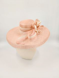 Sinamay hat in pale pink and ivory. Perfect for the Kentucky Derby and weddings. Also available in tan. This hat is more pink in person. Much like the photos with the model. Pink Wedding Hat, Hats And Fascinators, Sinamay Hat, Sinamay Hats, Wedding Hat, Elegant Hats, Kentucky Derby Hats, Louisville Kentucky, Handmade Hat