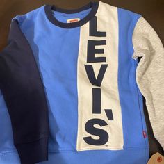 Boys Size 6 Y New With Tag Blue Long Sleeve Color Block T-shirt, Levi's Sporty Crew Neck Top, Blue Cotton Color Block Sweatshirt, Blue Color Block Cotton Sweatshirt, Levi's White Tops For Fall, White Levi's Tops For Fall, Levi's Blue Crew Neck Tops, Levis Shirt, Sherpa Hoodie