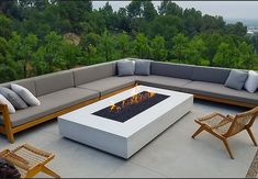 a fire pit sitting on top of a cement patio