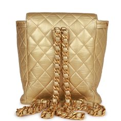 This Vintage Duma backpack is in Gold metallic lambskin with gold hardware, signature CC interlocking closure with front flap, an additional drawstring closure, exterior front pocket, two shoulder straps for backpack use, and gold metal and gold leather chain. The interior is lined in Gold metallic leather.Collection: 2-series (1991-1994)Origin: FranceCondition: Vintage; Excellent-Mint - There is light wear on the exterior leather including some creasing, a few scratch marks, and rubbing. There Chanel Duma Backpack, 2023 Fashion, Backpack Straps, Vintage Chanel, Leather Chain, Gold Leather, Metallic Leather, Gold Hardware, Front Pocket