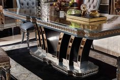 an elegant dining room table with chairs and a vase on the top, surrounded by ornately designed rugs