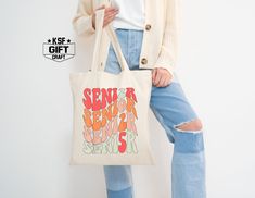 Senior 2025 Tote Bag, Trendy Senior 2025 Tote Bag, Back To School Tote Bag, Graduation Gift Tote Bag, School Tote Bags, Gift For Senior Personalized tote bags are perfect for yourself, Your Company, or as a gift! These are also the ideal bride's, Bridal Shower, Baby Shower, Birthday Party, gift, or proposal gift. IMPORTANT! Natural, White, Gold, Yellow, And Pink color totes Will be black Text color; all Other Colors Will Be White. (2024 Is Not Change) PRODUCT *Measurements15"L x 16"H *12 oz./yd² (US), 20 oz (CA), 100% heavy cotton canvas *20" canvas webbed handles * 9" handle drop *Made from Heavy duty cotton canvas fabric *DTF printing for the best color quality * Bulk discounts are available upon request. Check the Tote bag Color And Text Color Chart In the display Pictures Before Orderi White Rectangular Bag For Graduation Gift, School Tote Bags, Tote Bag School, Tote Bags For School, School Tote, Display Pictures, Bag School, Personalized Tote Bags, Dtf Printing