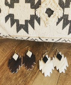 "So happy to announce that my shop is open again! I am going through chemo so my stock is limited during this time. Thank you all so much for your support. 10% of all proceeds will go to benefit familyreach.org, which helps cancer patients keep food on the table & a roof over their heads. Choose from white with black hair on cowhide or brown with white Aztec shaped earrings with black hair on cowhide triangle accent. These are the perfect balance of chic and statement. Each pair is made just Diy Western, Horsehair Jewelry, Cricut Earrings, Earring Inspo, Western Crafts, Leather Earring