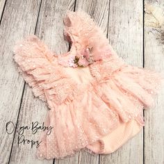 Size 9-12 months  This delicate romper is in pink neutral colors with delicate details will make a  perfect addition to your prop collection. The headband is INCLUDED in the sale.  This bodysuit is ready to ship.  This set will perfectly fit babies from approximately 18 to 24 pounds All items are made with care in a smoke/pet free environment. Please hand wash only in cold water and lay flat to dry for best care. Please take a look at my Facebook fan page and like it for all the news updates https://www.facebook.com/OlgaBabyProps Fitted Pink Bubble Romper For Baptism, Cute Pink Bubble Romper For Cake Smash, Pink Ruffled Bubble Romper For First Birthday, Fitted Bubble Romper With Ruffles For Cake Smash, Fitted Ruffle Bubble Romper For Cake Smash, Pink Ruffles Bubble Romper For Cake Smash, Sweet Pink Bubble Romper With Ruffles, Sweet Pink Ruffle Bubble Romper, Sweet Pink Ruffled Bubble Romper