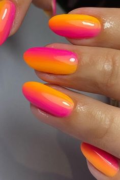 Dive into a tropical sunset with these almond-shaped nails, flaunting a seamless gradient blend of punchy pink and vivid orange. Each nail is topped off with a glossy finish and a precise white dot accent, creating a simple yet captivating touch to this bright and cheerful manicure. Perfect for any summer adventure or adding a pop of color to your everyday look! 🌅✨  // Photo Credit: Instagram @nailhustle Sunshine Nails Summer, Sunset Almond Nails, Biab Summer Nails Ideas, Tropical Nails Almond, Bright Orange And Pink Nails, Summer Sunset Nails, Orange And Pink Nails Summer, Warm Color Nails, Bright Ombre Nails Summer