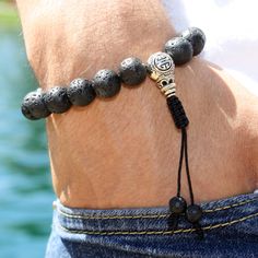 "It does not matter how deep you fall; what matters is how HIGH  you bounce back. This Lava Rock wrist mala will give you strength and courage, allowing you stability through times of change. In addition, it will provide you guidance and understating in situations where you need to \"bounce back.\" This lovely wrist mala bracelet is made with 8 mm or 10mm lava rock beads, 10 mm Silver Tibetan Guru bead, and 6 mm Lava rock beads pull ends. With an adjustable slide cobra knot. The Sliding knot closure makes the mala flexible approx 6-7cm, to allow going over the hand. 18 or 21-bead mala bracelet is a miniature, wrist-worn version of its larger counterpart, the 108-bead mala necklace. Perfect for beginners, you can work your way up! Perfect as a planned gift for a friend, loved one, or yourse Casual Bracelets For Meditation With 8mm Beads, Casual Bracelets With 8mm Beads For Meditation, Casual 8mm Beaded Bracelets For Meditation, Casual Hand-strung Lava Stone Bracelets, Adjustable Lava Stone Beaded Bracelets, Casual Adjustable Lava Stone Beaded Bracelets, Adjustable Hand-strung Lava Stone Bracelet, Casual Adjustable Lava Stone Jewelry, Casual Braided Bracelets With 8mm Beads As Gift