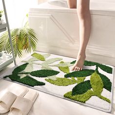 a woman is standing on the edge of a bathtub with her feet in the tub