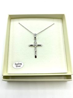 Made of 925 sterling silver with a glossy finish Neatly cut edges Classic crucifix design in an elegant pendant style Wearable with all types of clothing; casual, formal, or cocktail attire Light enough to be worn daily without discomfort Perfect gift choice for birthdays, Christmas, Easter, anniversaries and other special occasions This beautiful Silver Glossy Crucifix Necklace is perfect for any occasion. Crafted from sterling silver, this timeless piece features a high-gloss finish and classi Silver Crucifix Cross Necklace For Anniversary, Silver Crucifix Necklace For Formal Occasions, Formal Silver Crucifix Cross Necklace, Formal Silver Sterling Silver Cross Necklace, Stamped 925 Crucifix Necklace For Gift, Sterling Silver Crucifix Cross Necklace In White Gold, Silver Stamped 925 Cross Necklace For Gift, White Gold Sterling Silver Crucifix Necklace, Stamped 925 Cross Necklace For Gift