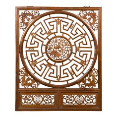 an intricate wooden panel with carvings on it