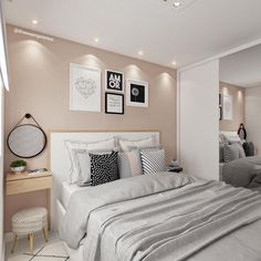 a bed room with a neatly made bed and pictures hanging on the wall above it