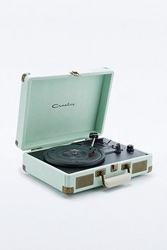 an old - fashioned record player is sitting in its case