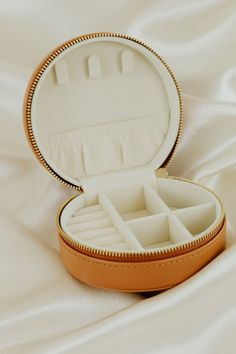 This camel color round travel case is the perfect storage for all of your sparkly Sarah O. jewelry while on the go! Portable Gold Jewelry Storage For Travel, Elegant Gold Round Case Jewelry Storage, Velvet Ring Box, Jewelry Cleaning Solution, Travel Stuff, Double Ring, Unique Diamonds, Camel Color, One Ring