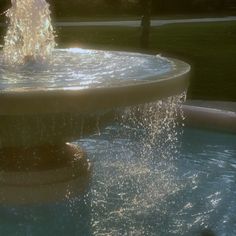 a fountain with water spouting from it's sides