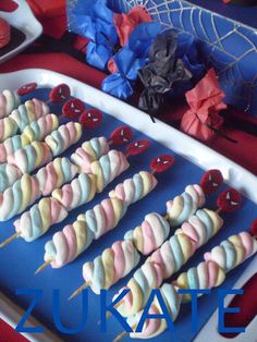 several skewers are arranged on a blue tray with red, white and blue decorations