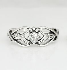 Handmade Celtic Claddagh ring in sterling silver With Heart shaped birthstone This is an Handmade high quality sterling silver ring Materials: 925 sterling silver and 4mm Heart shaped  faceted birthstone (shown on main picture with March) Measurements: front 8mm wide Handmade in Canada by our silversmith artist, select your birthstone. Beautiful filigree see-through design. Stamped 925 Exclusively here directly from it's Designer Artist ! All our jewelry include a gift box. Select bellow your size & stone. Comes with jewelry box Adjustable Heart Cut Sterling Silver Jewelry, Adjustable Sterling Silver Heart Cut Jewelry, Silver Birthstone Jewelry For Promise, Silver Promise Jewelry With Birthstone, Silver Sterling Heart Promise Ring, Sterling Silver Birthstone Ring For Promise With Prong Setting, Sterling Silver Heart Promise Ring, White Gold Sterling Silver Solitaire Heart Ring, Adjustable Sterling Silver Heart Cut Rings