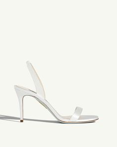 From sleek slingback straps to feminine pointed toes, the So Nude Pumps exude understated elegance. Expertly crafted in Italy from lustrous white satin, theyre the perfect way to elevate your day-to-night looks. The 85 mm stiletto heels instantly flatter the silhouette. Sleek White Formal Sandals, Sleek White Heels With Single Toe Strap, White Sleek Heels With Single Toe Strap, White Slingback Pumps With Sculpted Heel For Wedding, Classic White Slingback Pumps For Wedding, Classic Open Toe Slingback Pumps For Wedding, Aquazzura Shoes, Nude Sandals, Nude Pumps