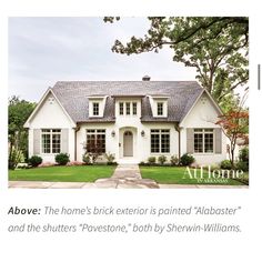 a white house with windows and shingles in the front yard that says above the home's brick exterior is painted alboaster and the shutters, both by shewn - williams