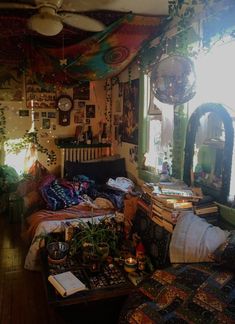 a living room filled with lots of furniture and decor on top of a wooden floor