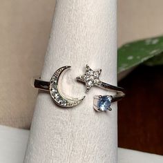 Dainty Sterling & Cz Crescent Moon And Star Ring, S925, Adjustable. With Light Blue And Clear Aaa+ Cz Colored Stones. Sterling Silver Marked S925. A Beautifully Made Ring. Nwot Ring Is Currently Sized At 6.25, But Can Be Adjusted To Fit Most. Makes A Great Gift For Daughter, Girlfriend, Wife, Mom, Christmas, Party, Holiday. A Great Item To Bundle And Save! . All Offers Considered. Crescent Moon And Star, Moon And Star Ring, Mom Christmas, Colored Stones, Gift For Daughter, Moon And Star, Star Ring, Crescent Moon, Womens Jewelry Rings