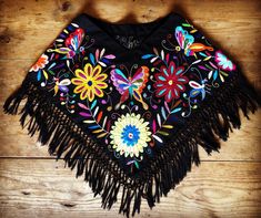 Beautiful poncho embroidered totally all by hand. It is pre-washed blanket with cotton threads, does not fade, does not shrink. For more designs visit our page: https://www.facebook.com/tenatuuu Festival Black Embroidered Poncho, One Size Embroidered Poncho For Festivals, Festival Colorful Floral Embroidered Poncho, Bohemian Embroidered Summer Poncho, Bohemian Multicolor Floral Embroidered Poncho, Embroidered Bohemian Poncho For Summer, Spring Festival Embroidered Poncho, Multicolor Embroidered Bohemian Poncho, Festival Poncho With Multicolor Floral Embroidery