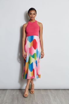 Our playful Pleated Midi Dress has a playful vibe. The halter neckline & viscose knit bodice combines with a graphic georgette print pleated skirt to create a standout dress. Definitely poetry in motion!    Viscose Halter Bodice Knit Dress with Printed Pleated Midi Skirt   49% Polyester, 33% Viscose, 16% Nylon, 2% Spandex   Runs true to size.   Model is 5'9" and wearing size S   Imported   Style #: ETR41345 Mixed Media Dress, Printed Pleated Skirt, Print Midi Dress, Pleated Midi Dress, Elie Tahari, Pleated Midi Skirt, Printed Midi Dress, Halter Neckline, Pleated Skirt