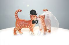 Orange Tabby Cat Wedding Cake Topper  Please Note: Cats pictured here are pre-molded plastic, and as such this particular version is not alterable. All of the accessories like the hat/bows/flowers, however, are. ABOUT This cake topper would be the perfect final touch to sit atop any wedding cake. THE ORDER Order includes two figurines (female/male; male/male; female/female), as well as your choice of accessories (i.e. bow, hat, roped garland, veil).   DIMENSIONS Cats: 2 inches in length and 2.25 Fun Wedding Cake Toppers, Cat Wedding Cake, Cat Wedding Cake Topper, Kitten Cake, Cake Toppers Wedding, Small Kitten, Dog Cake Topper Wedding, Cat Cake Topper, Cat Custom