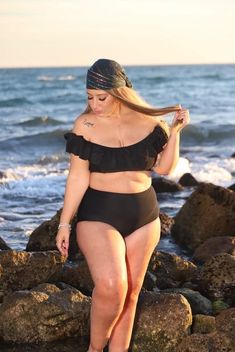 Black Off-shoulder Swimwear For Beach, Black Off-shoulder Swimwear For Beach Season, Black Ruffled Swimwear For Beach Season, Off-shoulder Black Swimwear For Beach Season, Off-shoulder Black Swimwear For Beach, Black Stretch Tankini With Ruffles, Black Stretch Ruffle Tankini, Black Ruffled Stretch Tankini, Black Ruffled Swimwear For Pool