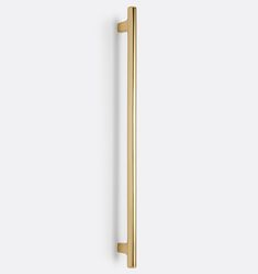 an image of a gold door handle on a white wall