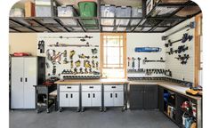 a garage filled with lots of tools and cabinets