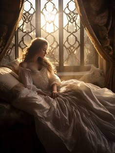 a woman sitting on top of a bed next to a window in a room with curtains