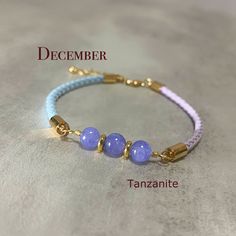 All bracelets are handmade and designed by us. In our store you will find high quality jewelry and in a reasonable price. -Bracelet Description- Tanzanite is the birthstone of December.  All crystal beads in our store are natural and in high grade.  As we always looking for making our design something different from others, for this bracelet we use real soft leather cord with two different ways of closure styles and both of them are adjustable. -Materials and Size- Leather Cord Width: 3mm Access Handmade Purple Bracelet For Birthday Gift, Spiritual Gemstone Beads Braided Bracelet As Gift, Handmade Spiritual Bracelets As Birthday Gift, Handmade Spiritual Bracelets For Birthday Gift, Handmade Spiritual Bracelet For Birthday, Handmade Beaded Bracelets For Birthday, Handmade Spiritual Beaded Bracelets For Birthdays, Handmade Round Braided Bracelets As Gift, Closure Styles