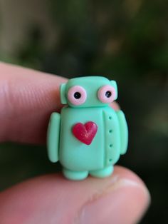 *What it is: I miniature handmade robot figurine! Handcrafted from polymer clay. *Size: Measures about 1 & 1/2cm tall. Handmade Robot, Clay Robot, Green Robot, Mini Pastel, Robot Sculpture, Polymer Clay Animals, Toca Life