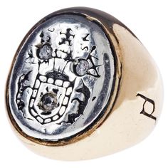 White Diamond Crest Signet Ring 14k Yellow and White Gold J Dauphin Inspired by Queen Mary of Scots ring. Gold signet-ring; engraved; shoulders ornamented with flowers and leaves. Oval bezel set with silver intaglio depicting achievement of Mary Queen of Scots: shield of Scotland surrounded by collar of thistle, supported by two unicorns; crest: crowned lion sejant affronté holding sword; dexter: banner with arms of Scotland; sinister: flag with three bars over saltire. Inscribed with a monogram Queen Mary Of Scots, Mary Of Scots, Signet Ring Silver, Green Diamond Rings, Gold Flower Ring, Silver Signet Ring, Contemporary Ring, Gold Signet Ring, Harvey Nichols