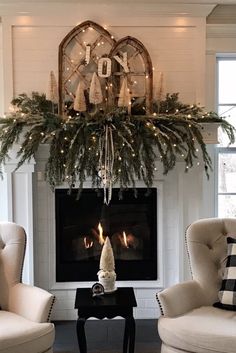 a living room filled with furniture and a fire place covered in greenery next to a fireplace