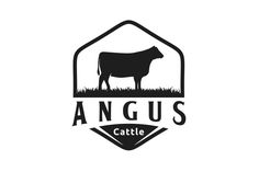 the logo for angus cattle cattle, which is located in an open area with grass and