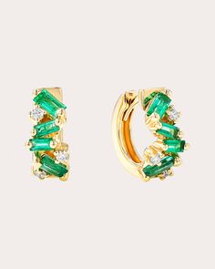 Unapologetically bold, these huggie earrings are decorated with asymmetric clusters of round white diamonds and baguette-cut emeralds. The 18-karat yellow gold bases create a dimensional effect. Hinge click closure 18k yellow gold, emerald and white diamond Carat: 0.1 ctw diamond, 0.7 ctw emerald Diamond color: G Diamond clarity: VS Polish with soft cloth Made in the USA Measurements Width: 5.5mm Suzanne Kalan, Diamond Hoop Earrings, Huggie Earrings, Emerald Diamond, White Diamonds, Huggies Earrings, Diamond Clarity, White Diamond, Diamond White