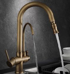 a kitchen faucet with water running from it