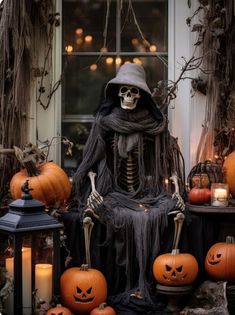 a skeleton sitting on top of a pile of pumpkins