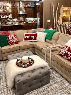 a living room filled with lots of furniture and christmas decorations on top of it's walls