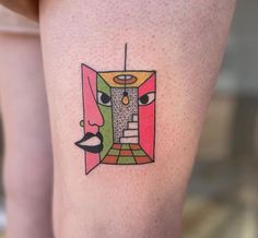 a woman's leg with a tattoo on it that has an image of a door