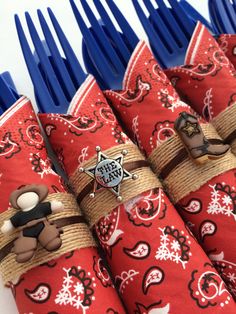 several red and white napkins with blue forks