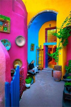 the front cover of a magazine with an image of colorful houses and doorways in different colors