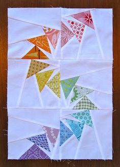 a piece of paper with different colored kites on it