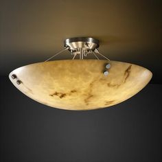 a semi - flush ceiling light fixture with marbled glass in an oval bowl shape