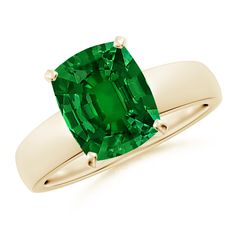 a ring with an emerald stone in it