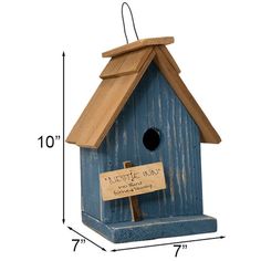 a blue birdhouse with a sign hanging from it's side and measurements for the height