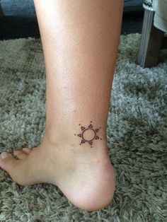 a person with a small tattoo on their foot