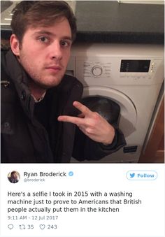 a man is pointing at the camera in front of a washing machine