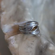 Our best selling 'Muse' ring is now available in silver! This adjustable silver ring is sculpted to define your daily look with a beautiful scratched surface.  100% waterproof + tarnish free ✦ MATERIALS ✦  ・Stainless Steel ✦ SIZE ✦  This ring is fully adjustable and will fit all sizes. To wear this ring on any finger, simply squeeze or pull gently to modify the size.  ✦ CARE ✦  A waterproof, tarnish-free and durable design made for everyday. ✦ LOOKING FOR A DIFFERENT ITEM? ✦  Check out my Etsy store for more gold plated handmade jewellery (www.etsy.com/uk/shop/nisijewelleryco). Finally, if you have any questions or special requests then please do not hesitate to get in contact with me and I will be happy to help. Thank you for supporting my little business - I appreciate it very much! Unique Silver Stackable Rings With Polished Finish, Hand Cast Wide Band Silver Sterling Ring, Hand Cast Sterling Silver Wide Band Ring, Nickel Free Promise Rings, Silver Open Band Promise Jewelry, Silver Wide Band Hand Cast Ring, Silver Wide Band Ring Hand Cast, Nickel Free Open Ring For Promise, Nickel-free Open Ring For Promise